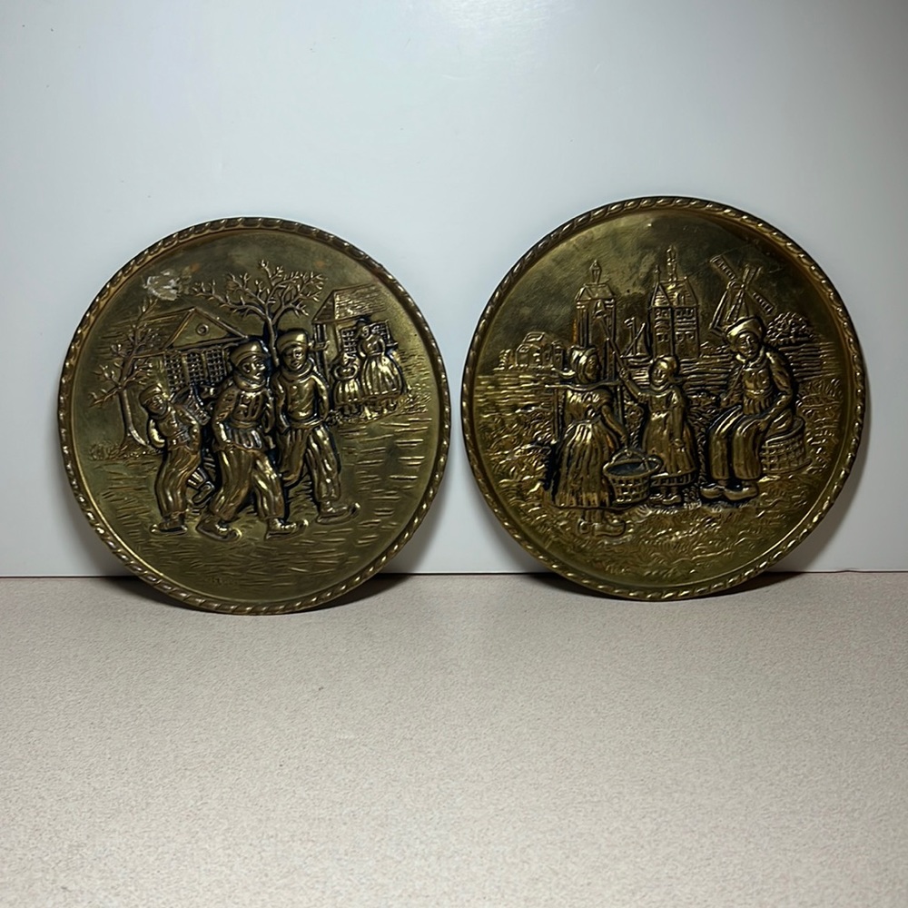 Vintage embossed brass wall plates Dutch